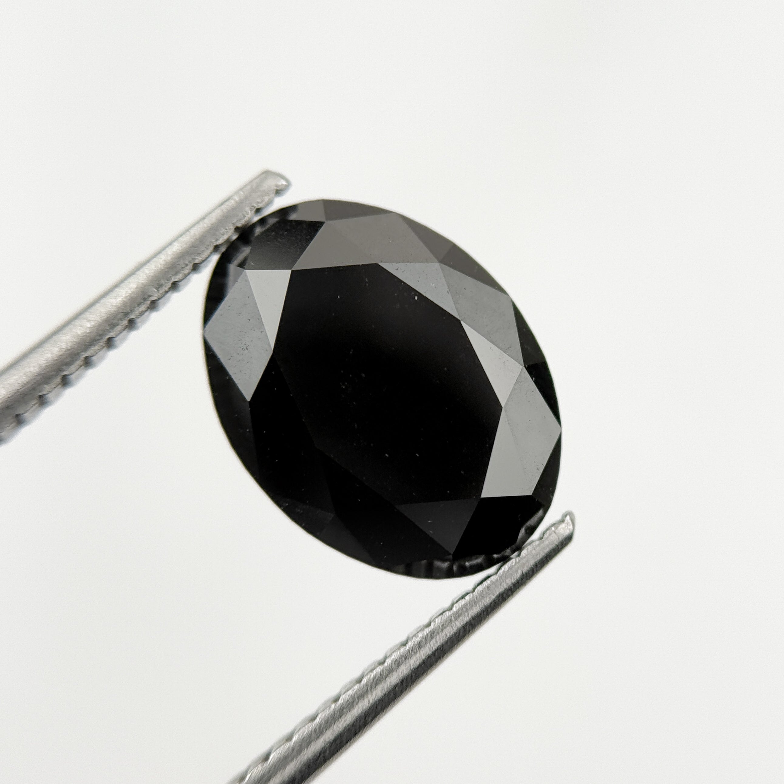 12 MM Oval Brilliant Cut Black Natural Minimal Diamond