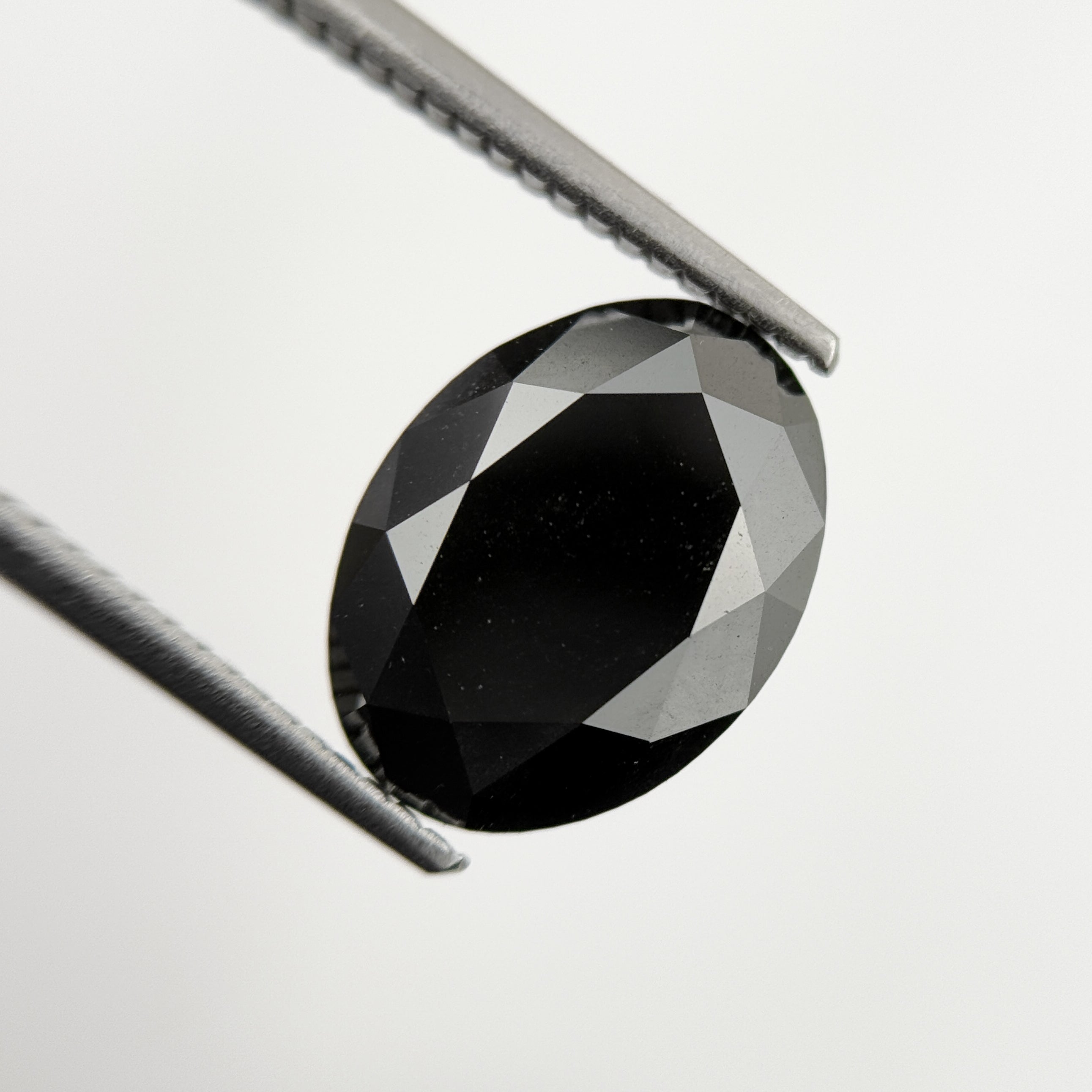 12 MM Oval Brilliant Cut Black Natural Minimal Diamond