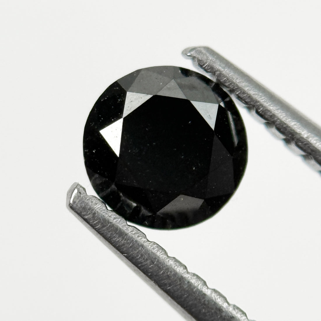 0.60 Ct Round Brilliant Cut Black Natural Salt and Pepper Diamond