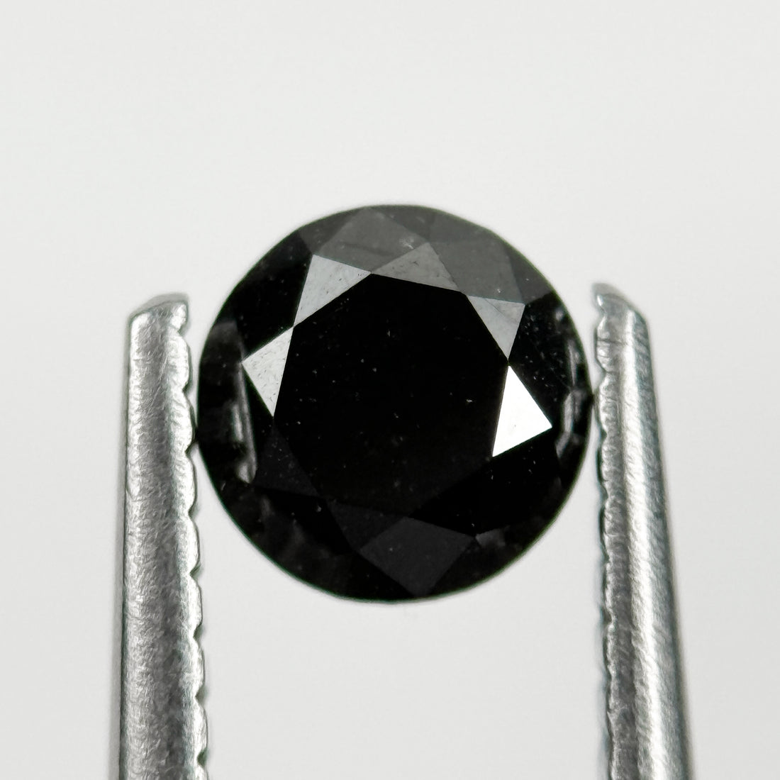 0.60 Ct Round Brilliant Cut Black Natural Salt and Pepper Diamond