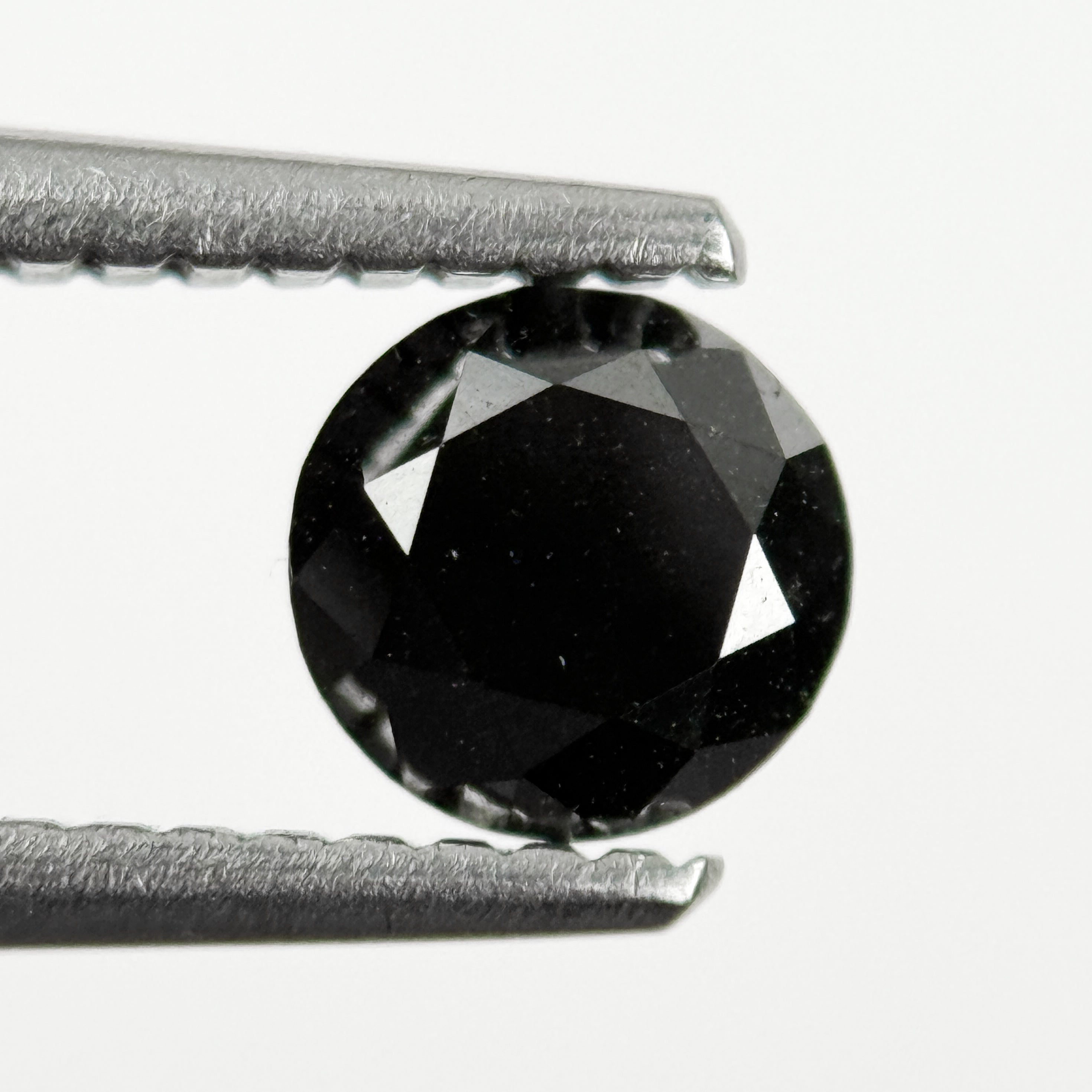 0.60 Ct Round Brilliant Cut Black Natural Salt and Pepper Diamond