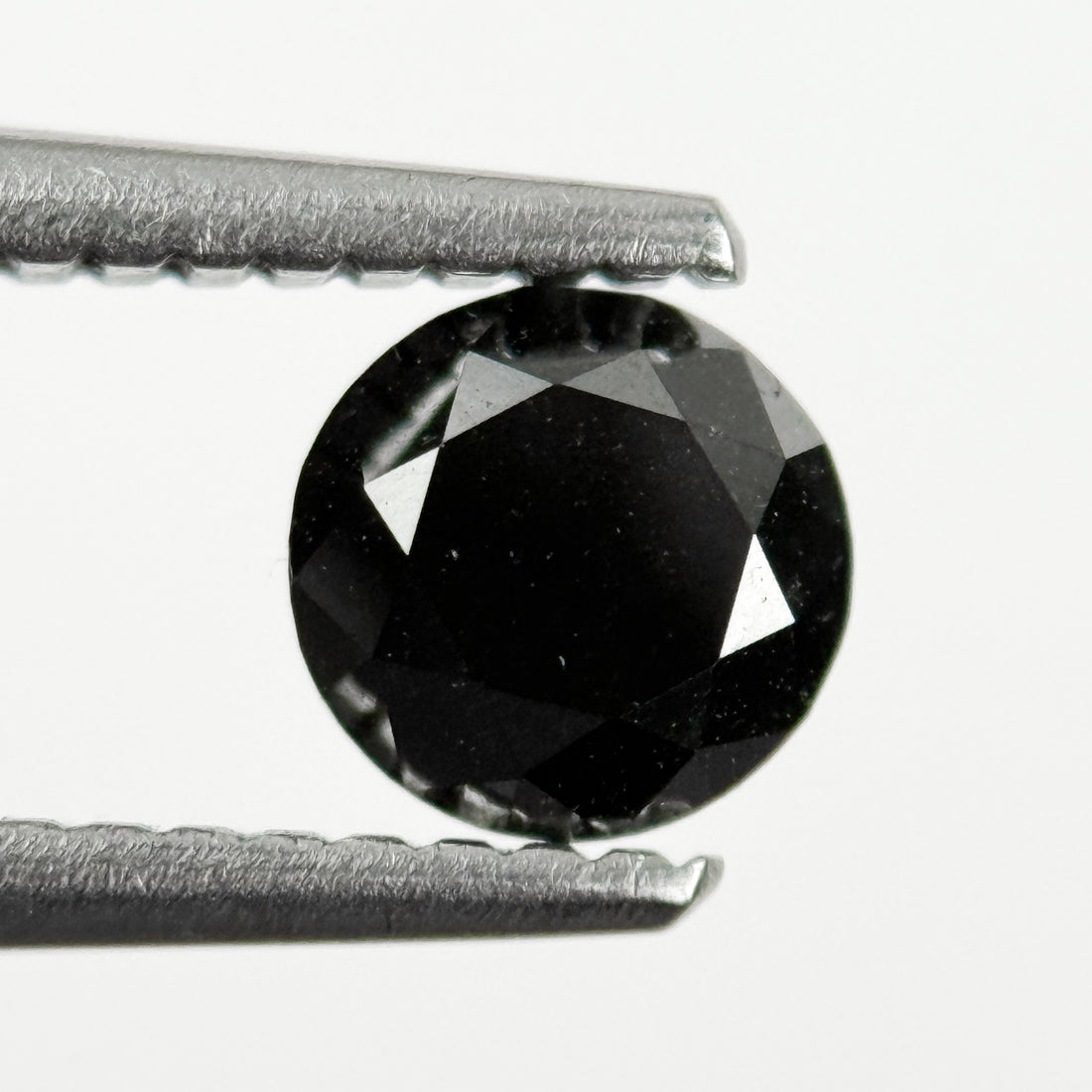 0.60 Ct Round Brilliant Cut Black Natural Salt and Pepper Diamond