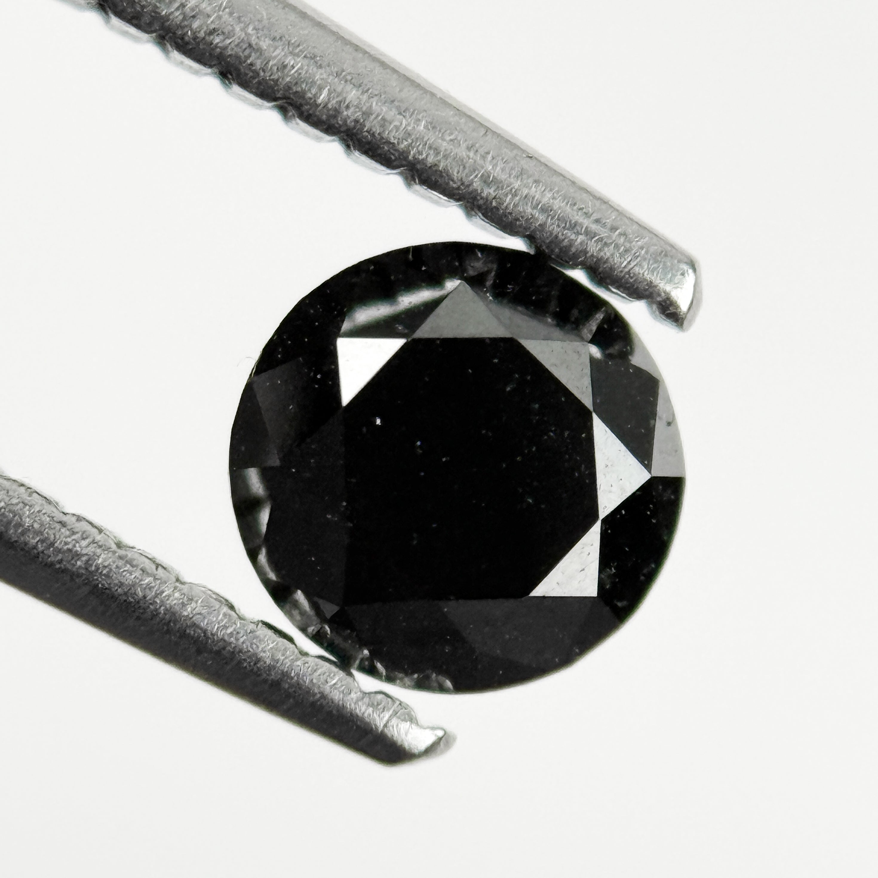 0.60 Ct Round Brilliant Cut Black Natural Salt and Pepper Diamond