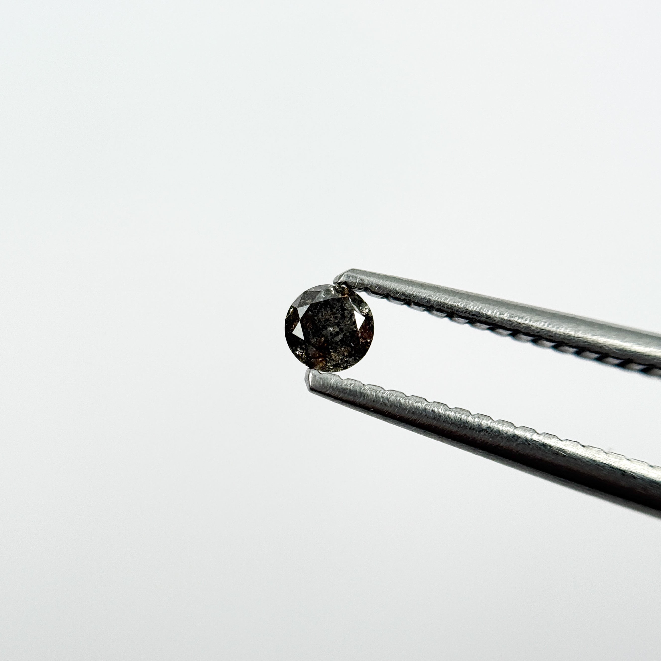 0.15 Ct Round Brilliant Cut Black Natural Salt and Pepper Diamond