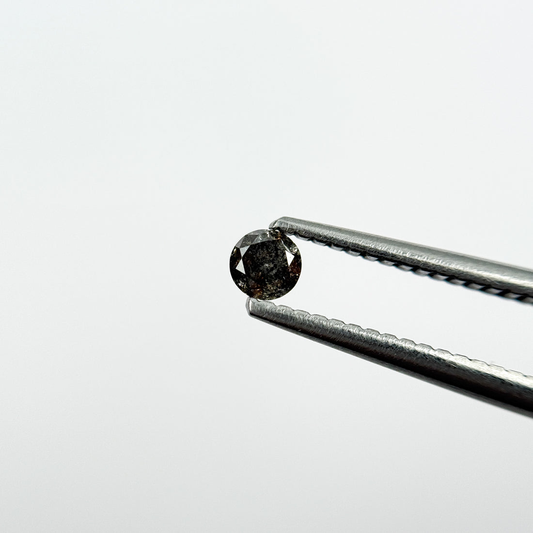 0.15 Ct Round Brilliant Cut Black Natural Salt and Pepper Diamond